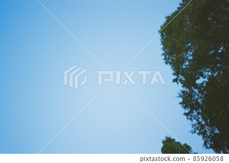 Blue sky and contrails taken with a film camera 85926058