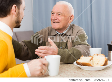 Father and son enjoying evening Father and son enjoying evening 85926205