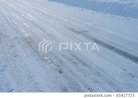 Frozen road surface in winter Frozen road surface in winter 85927725