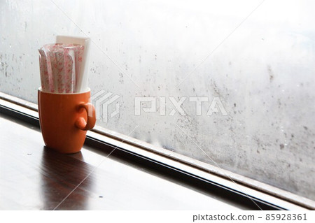 Sugar cup placed on the window side of the cafe Sugar cup placed on the window side of the cafe 85928361
