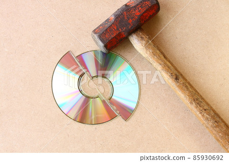 Broken CD and hammer Broken CD and hammer 85930692