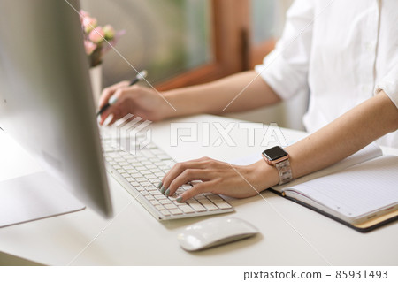 A businesswoman or female working on desktop computer A businesswoman or female working on desktop computer 85931493