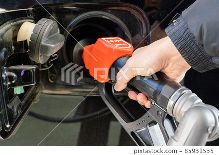 Refueling at a gas station Refueling at a gas station 85931535