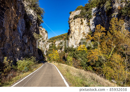 Driving through Foz de Arbayun canyon of Salazar River in the Pyrenees in Spain Driving through Foz de Arbayun canyon of Salazar River in the Pyrenees in Spain 85932038