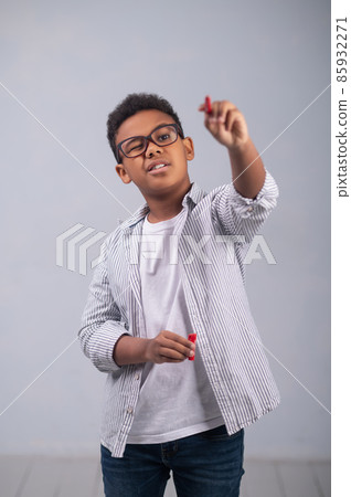 Concentrated African American schoolkid making a sketch Concentrated African American schoolkid making a sketch 85932271