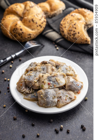 Chopped marinated fish. Salted herring 85934909