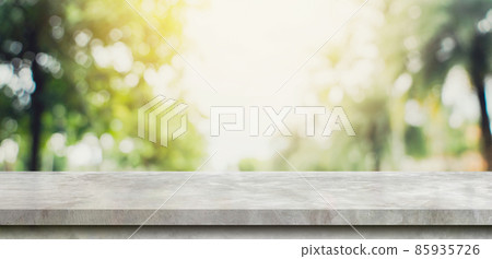 Empty concrete stone table top and Abstract blurred light bokeh and blur background of garden trees in sunlight. product display template with copy space. Empty concrete stone table top and Abstract blurred light bokeh and blur background of garden trees in sunlight. product display template with copy space. 85935726