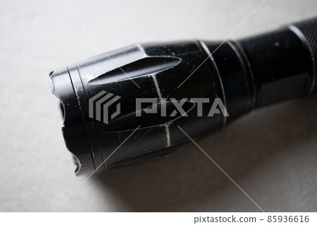 used flashlight shocker  close-up in concept of protection and security 85936616