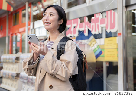 A woman sightseeing in Osaka Shinsekai A woman sightseeing in Osaka Shinsekai 85937382