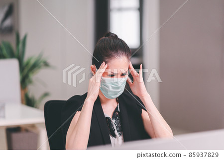 Asian woman have a migraine during working at office,Female suffering from headache 85937829