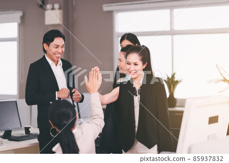 Team asian people giving hands high five together at office,Teamwork successful meeting finishing up Team asian people giving hands high five together at office,Teamwork successful meeting finishing up 85937832
