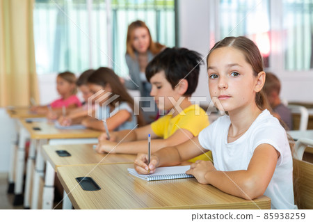 Kids studying in classroom 85938259