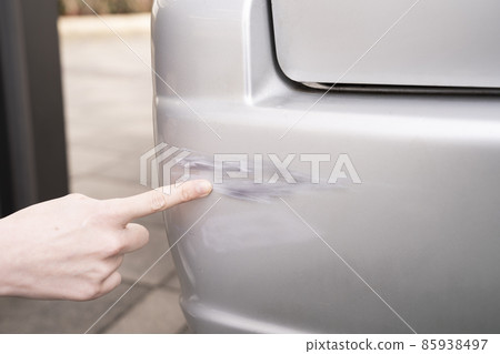 Hands of a woman who is depressed by damaging a car during work Hands of a woman who is depressed by damaging a car during work 85938497