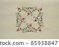 Square napkin of bouquets with red-pink roses and leaves, delicate violets and white flowers on a beige fabric background. 85938847