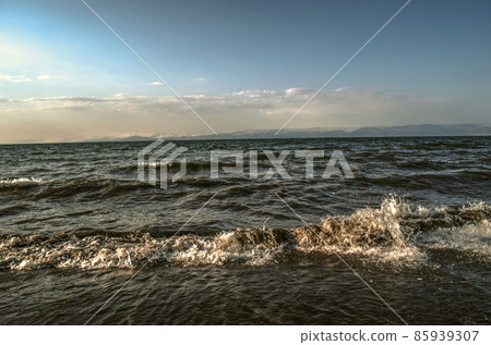 Evening stormy tide on the alpine lake Sevan near the city of Martuni in Armenia Evening stormy tide on the alpine lake Sevan near the city of Martuni in Armenia 85939307