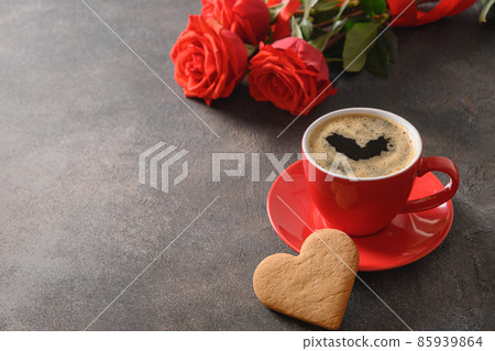 Valentine's day heart shaped cookie, black coffee and red roses. 85939864