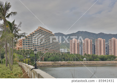 Golden hour, Gold Coast, Hong Kong. Sun sets behind resort hotel 17 Dec 2021 Golden hour, Gold Coast, Hong Kong. Sun sets behind resort hotel 17 Dec 2021 85941431