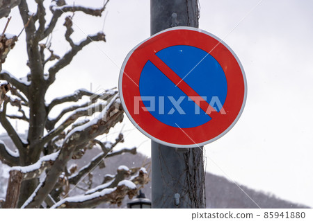Road sign "No parking" on snowy days. 85941880
