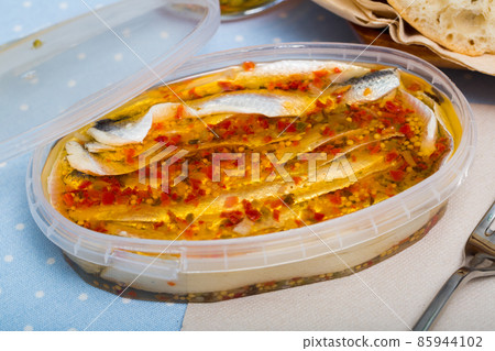 Herring preserves in a plastic jar 85944102
