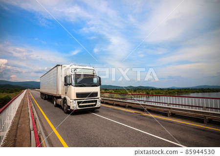 White truck on a bridge. 85944530