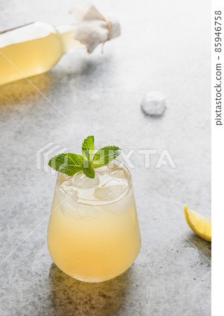 Kombucha healthy beverage with lemon. Organic probiotic drink. Close up. Kombucha healthy beverage with lemon. Organic probiotic drink. Close up. 85946758