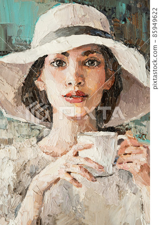 A girl in a white hat with a cup of coffee sits in a cafe. A girl in a white hat with a cup of coffee sits in a cafe. 85949622