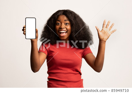 Online Offer. Portrait Of Emotional Excited Black Female Holding Blank Smartphone 85949710