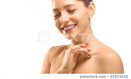 Close-up portrait of a 40 years old woman with closed eyes touching her skin. Skin care concept. Close-up portrait of a 40 years old woman with closed eyes touching her skin. Skin care concept. 85951638