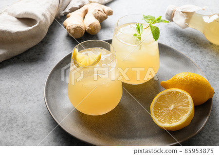 Homemade Kombucha healthy drink in bottle and glass with lemont. Homemade Kombucha healthy drink in bottle and glass with lemont. 85953875