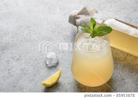 Homemade Kombucha healthy drink in bottle and glass with lemont. 85953878