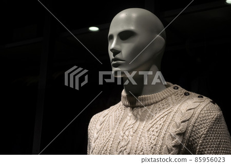 Closeup of beige pullover on mannequin in a fashion store showroom 85956023