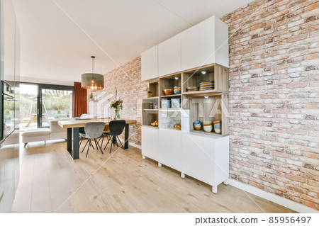 Little zoan dining room next to white cupboard 85956497