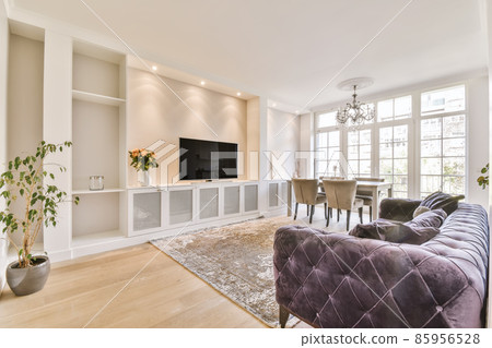 Stylish living room with purple velvet sofa 85956528