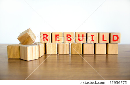 Rebuild and build symbol. The concept word Rebuild on wooden cubes. Beautiful wooden table, white background, copy space. Business rebuild and build concept. Rebuild and build symbol. The concept word Rebuild on wooden cubes. Beautiful wooden table, white background, copy space. Business rebuild and build concept. 85956775