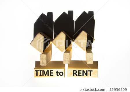 Time to rent house symbol. Concept words 'Time to rent' on wooden blocks near miniature houses from shadows. Beautiful white background, copy space. Business and time to rent house concept. Time to rent house symbol. Concept words 'Time to rent' on wooden blocks near miniature houses from shadows. Beautiful white background, copy space. Business and time to rent house concept. 85956809
