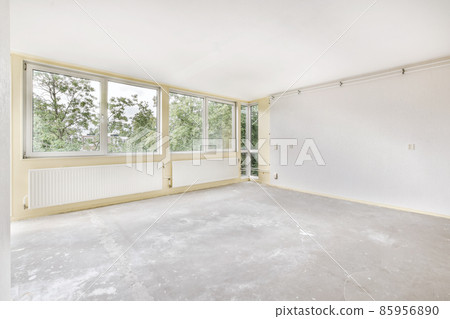 Spacious bright room with a wall-to-wall window 85956890