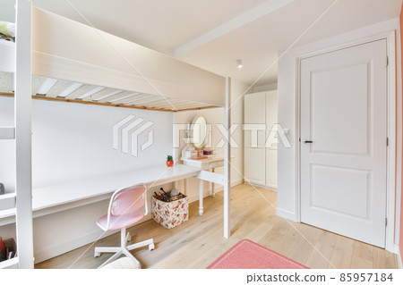 Lovely pink kids bedroom with comfy chair 85957184