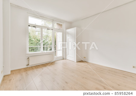 Mind-blowing room with a large window in a luxury home Mind-blowing room with a large window in a luxury home 85958264