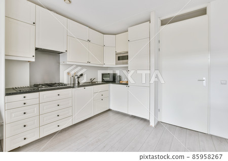 Minimalist corner kitchen with microwave and oven Minimalist corner kitchen with microwave and oven 85958267