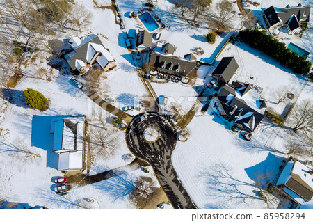 A perfect neighbourhood houses in suburb at winter in the north America homes covered nice snow 85958294