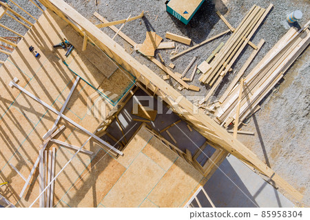 Unfinished of view of a house residential construction framing against 85958304