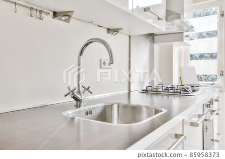 Superior kitchen design with wood worktop and white kitchen unit 85958373