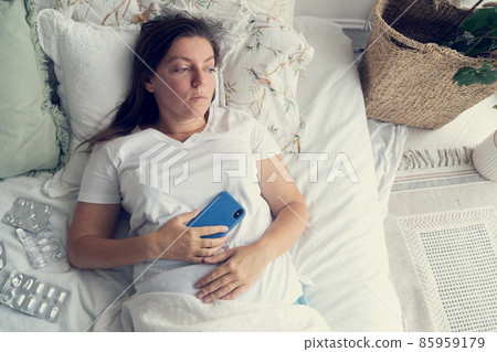 Sick woman in bed 85959179