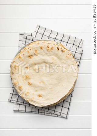 Arabic bread. Flat pita bread. Arabic bread. Flat pita bread. 85959419