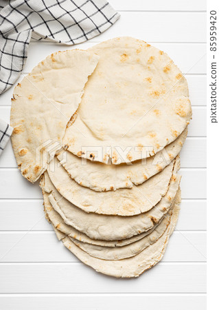 Arabic bread. Flat pita bread. Arabic bread. Flat pita bread. 85959420