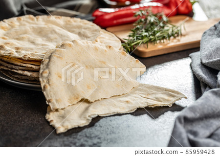 Arabic bread. Flat pita bread. Arabic bread. Flat pita bread. 85959428