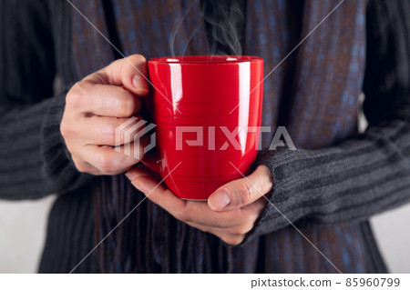 Girl with red cup of hot coffee Girl with red cup of hot coffee 85960799