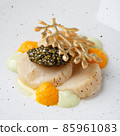 Baked scallop with black caviar. 85961083