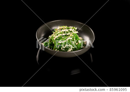 Chuka salad with peanut sauce. 85961095