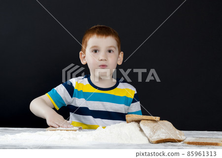 portrait of a baby boy in the kitchen portrait of a baby boy in the kitchen 85961313